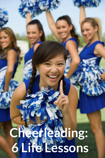 Cheerleaders waving pom poms